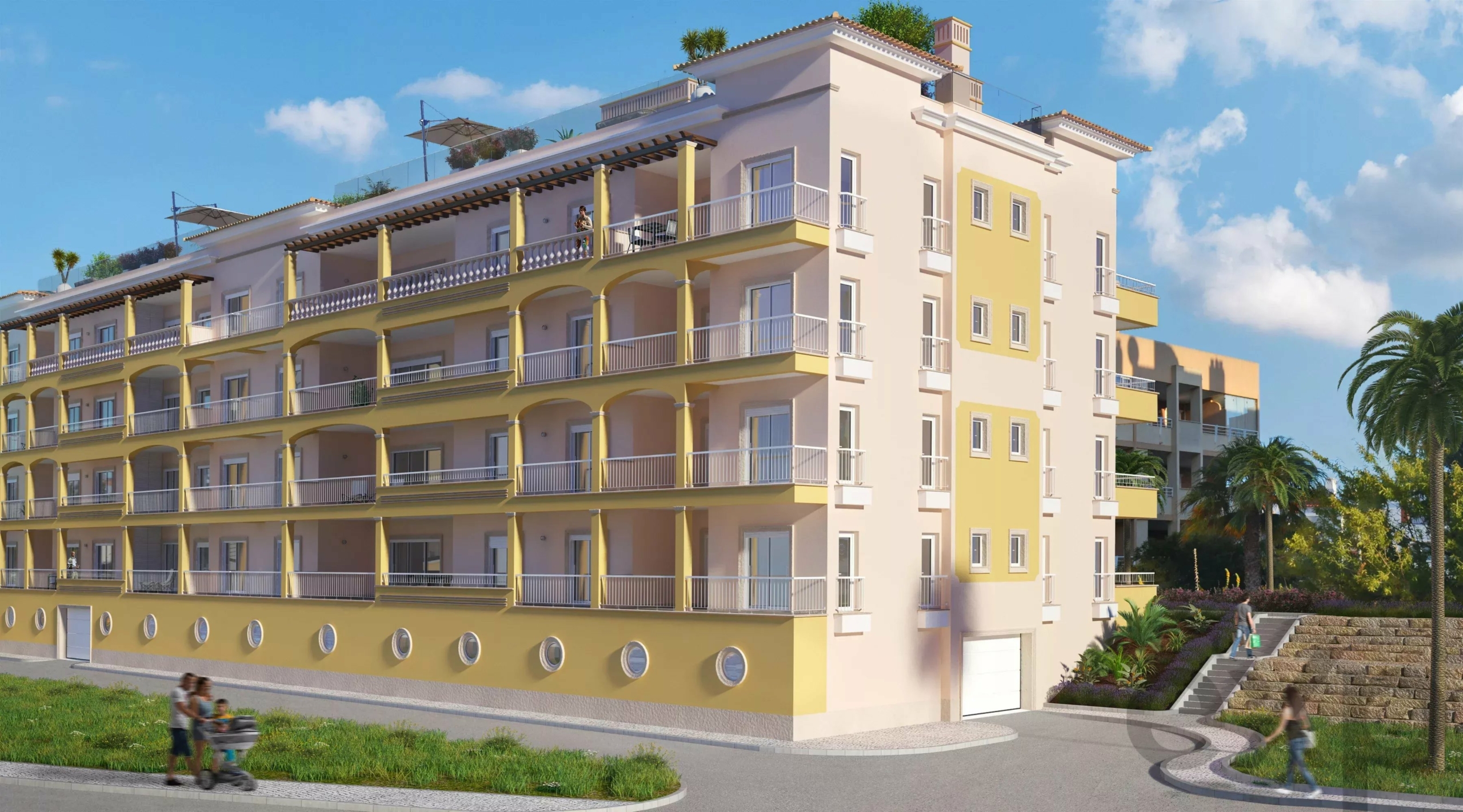 Modern multi-story apartment building with yellow and beige facade, balconies, and palm trees under a blue sky.
