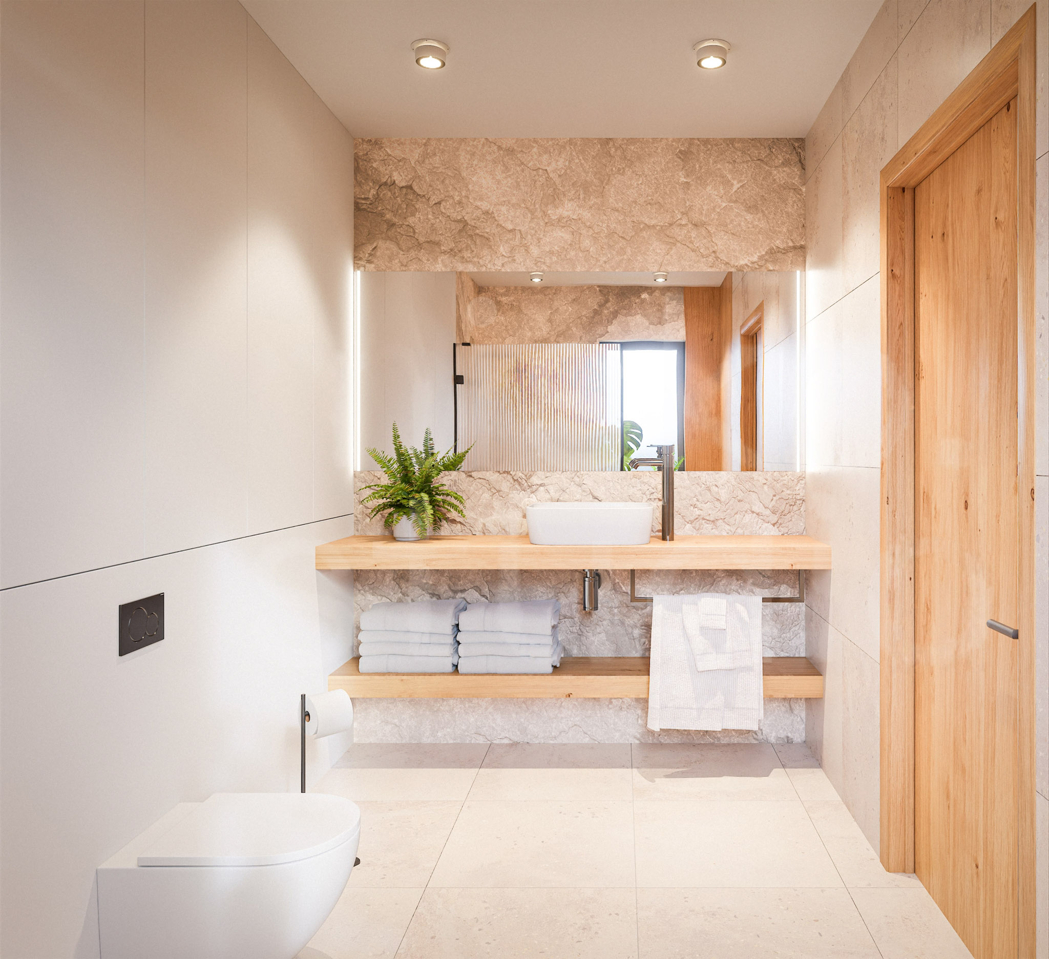 Modern bathroom with beige marble walls, a white vessel sink on a wooden shelf, stacked towels, and a fern plant nearby.
