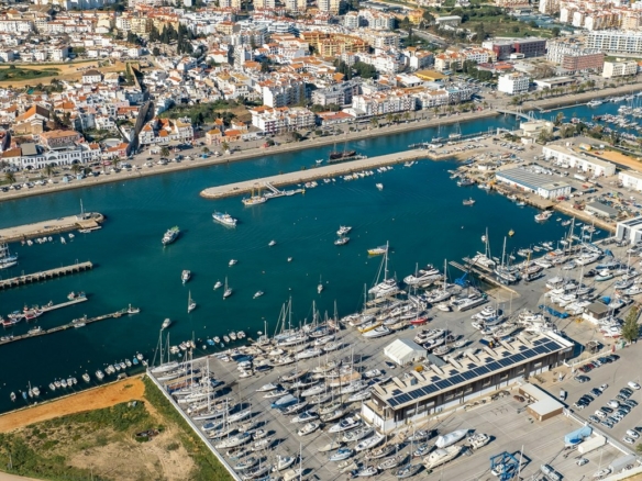 Aerial drone view of Lagos Marina in the Algarve, Portugal, showing the boat marina, river and town, the area where non-resident Americans buy with a Portuguese mortgage