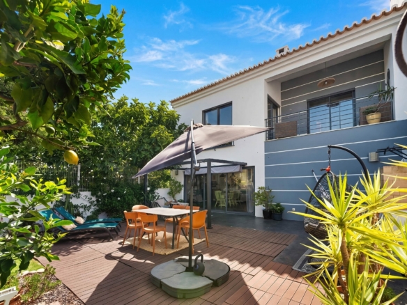 Garden and terrace of a four-bedroom family house for sale in Sargacal, Lagos, illustrating the cost of selling a property in Portugal in 2026