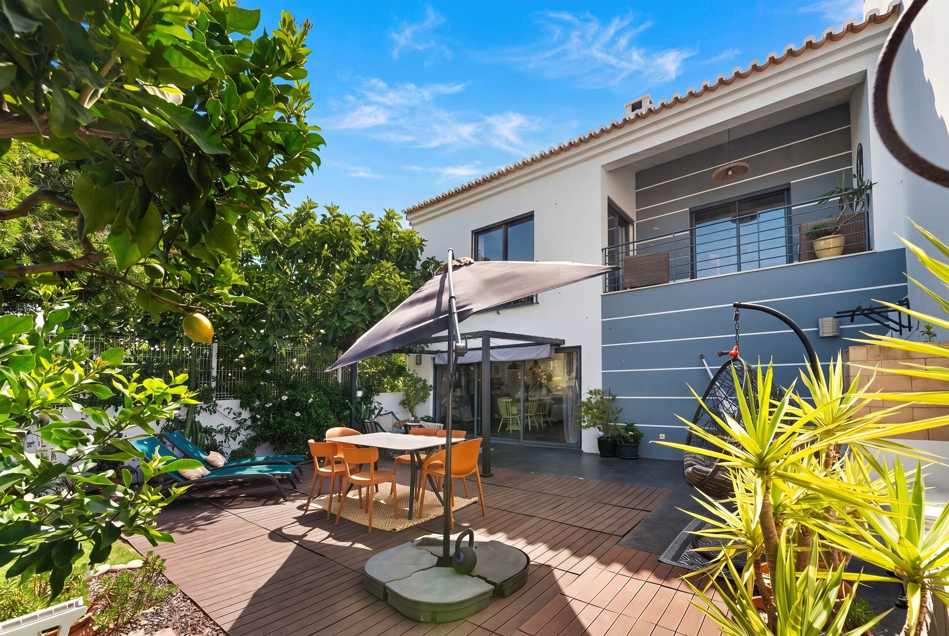 Garden and terrace of a four-bedroom family house for sale in Sargacal, Lagos, illustrating the cost of selling a property in Portugal in 2026